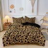 A leopard print duvet cover set displayed on a bed with a light wall and wooden side table.