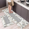 A set of two non-slip waterproof kitchen rugs with a diamond print placed on a light wood floor.