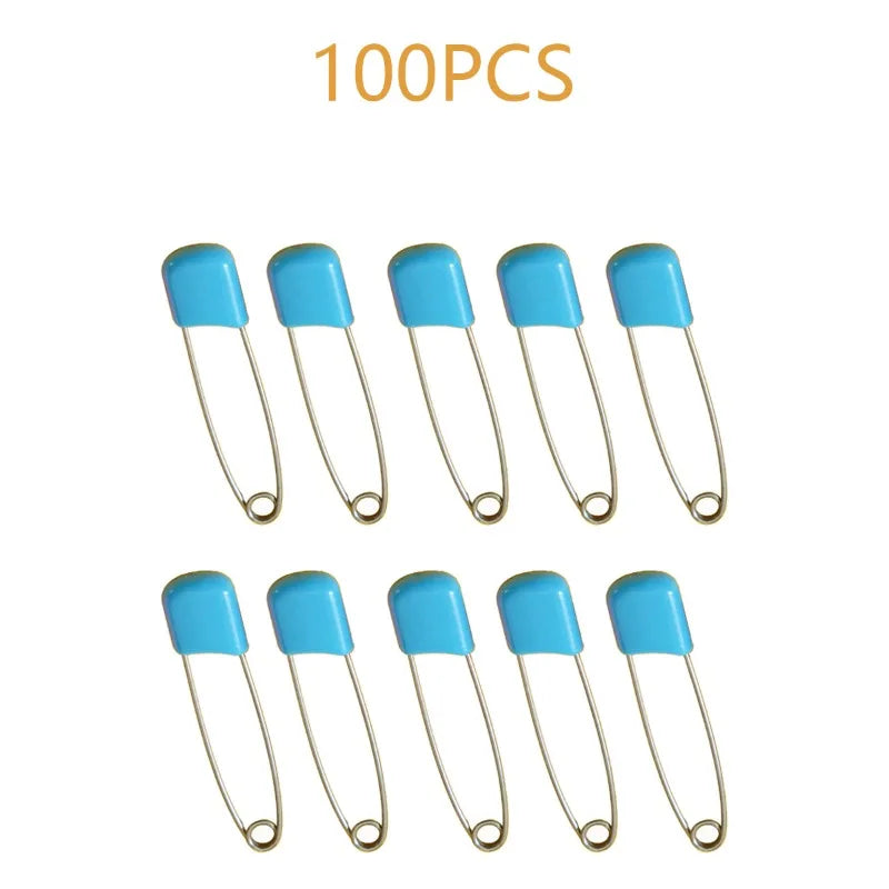 A collection of 100 stainless steel blue diaper pins with safety locking closures.