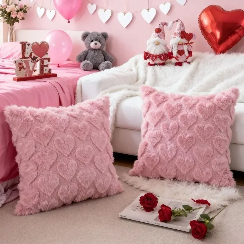 Pink heart embroidery plush cushion covers and a teddy bear on a white sofa