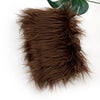 A pile of dark brown faux fur plush fabric used for sewing and crafting.