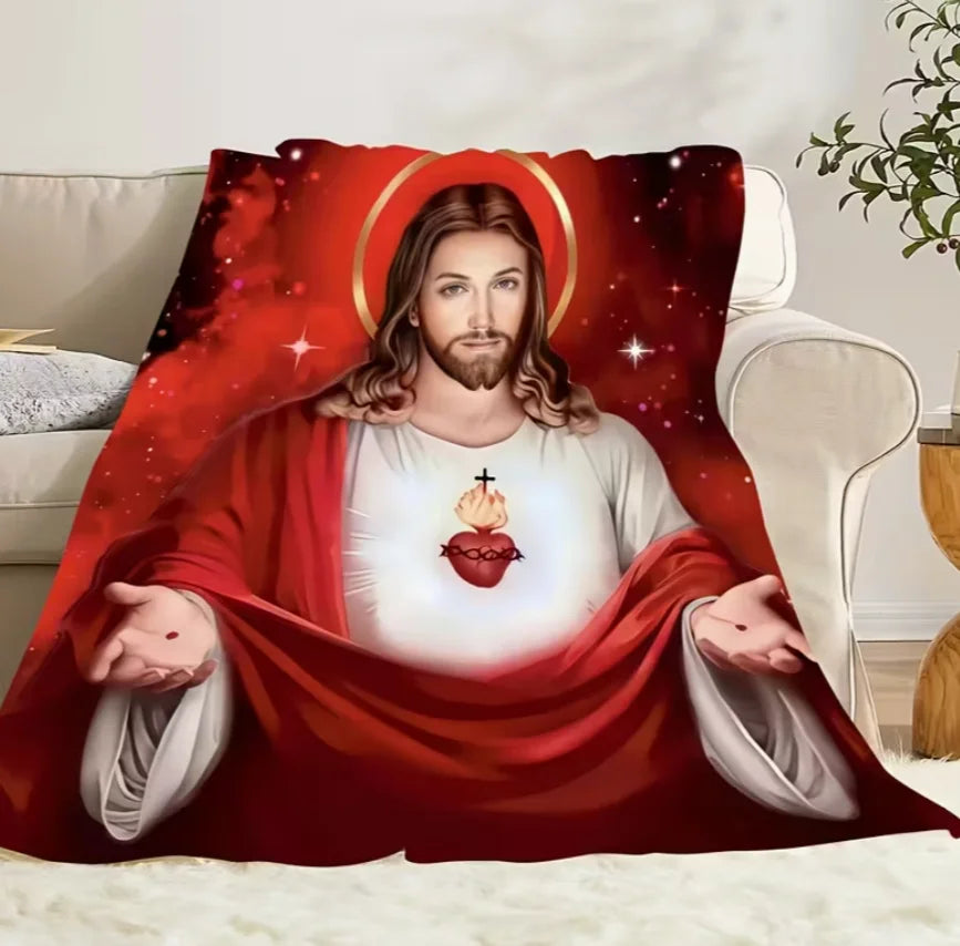 A red and black graphic featuring the Sacred Heart Jesus on a flannel throw blanket.