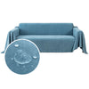 A light blue waterproof sofa cover draped over a piece of furniture, with a circular close-up showing water droplets.