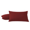 A pair of solid maroon microfiber pillow covers.
