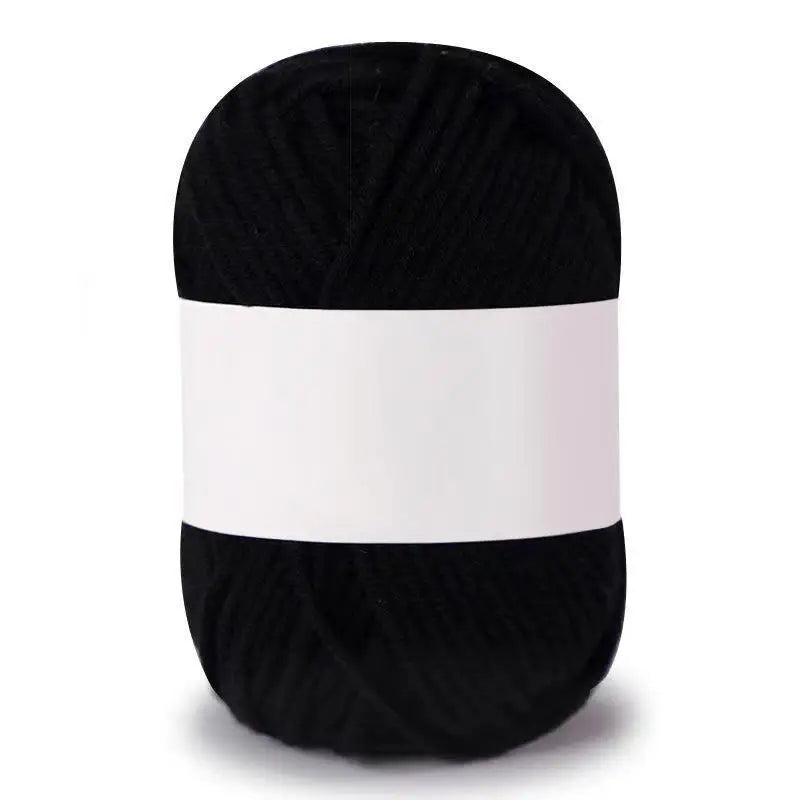 A skein of black soft milk cotton knitting yarn
