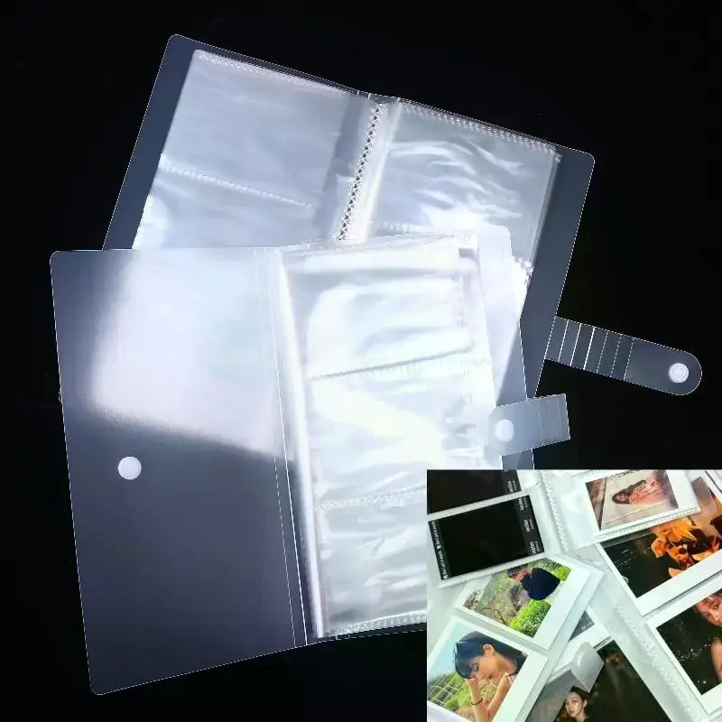A clear plastic photo storage card album with a glossy finish shown open.