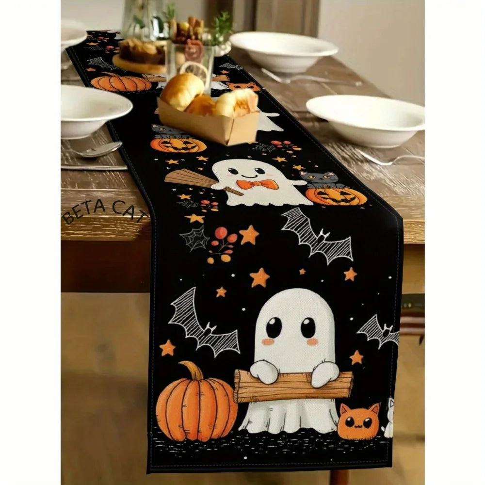 Black Halloween table runner featuring a design with pumpkins, bats, and spiders.