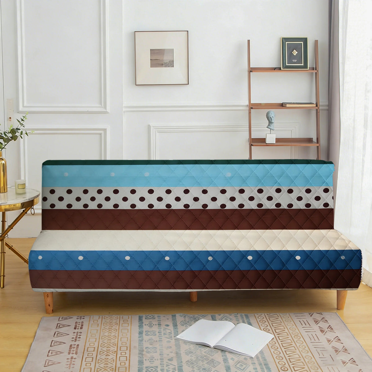 A modern sofa cover featuring horizontal stripes of blue, brown, and white with a quilted texture.