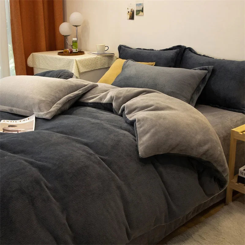 A dark gray luxurious flannel duvet cover set is displayed on a bed with yellow accents and natural light.