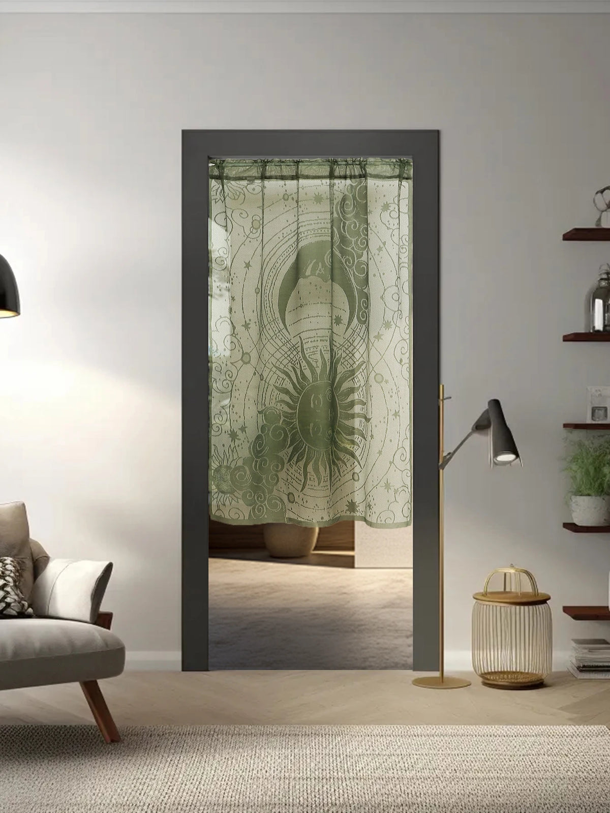 A vertical window with a sheer green lace curtain featuring sun and moon designs.