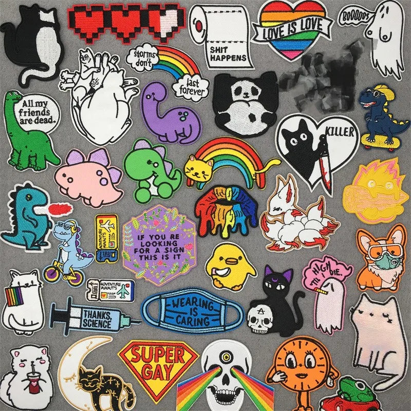 A collection of colorful and themed iron-on patches featuring various symbols, animals, and text.