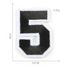 A black embroidered number 5 patch with white stitching, measuring 5 cm high and 3.6 cm wide.