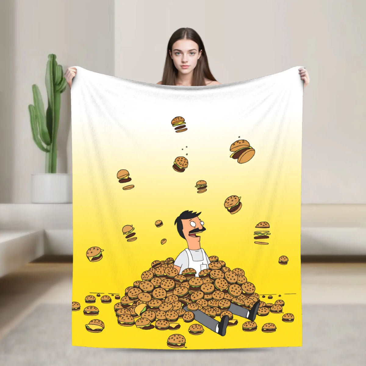 A yellow throw blanket featuring a cartoon character and scattered food items.