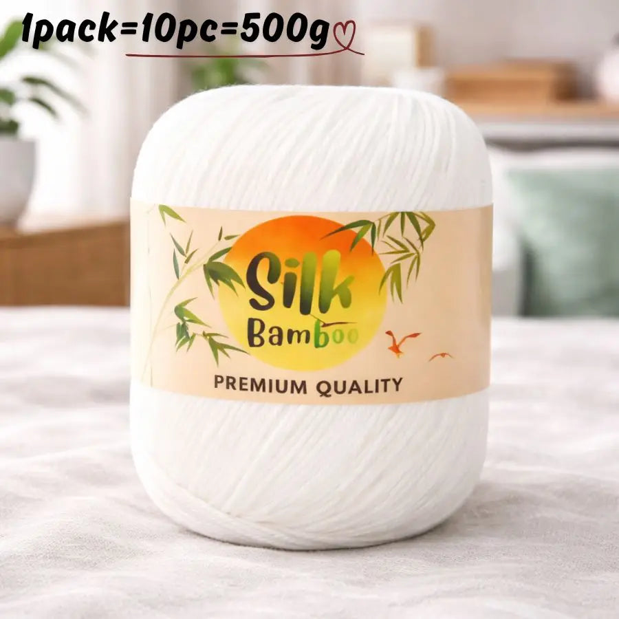 A white ball of silk bamboo blend yarn labeled premium quality for knitting and crochet.