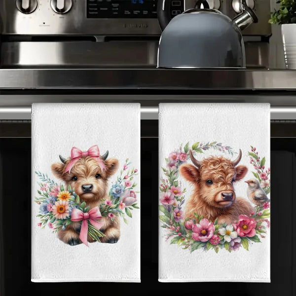 A set of kitchen towels featuring watercolor illustrations of adorable puppies surrounded by floral clusters.