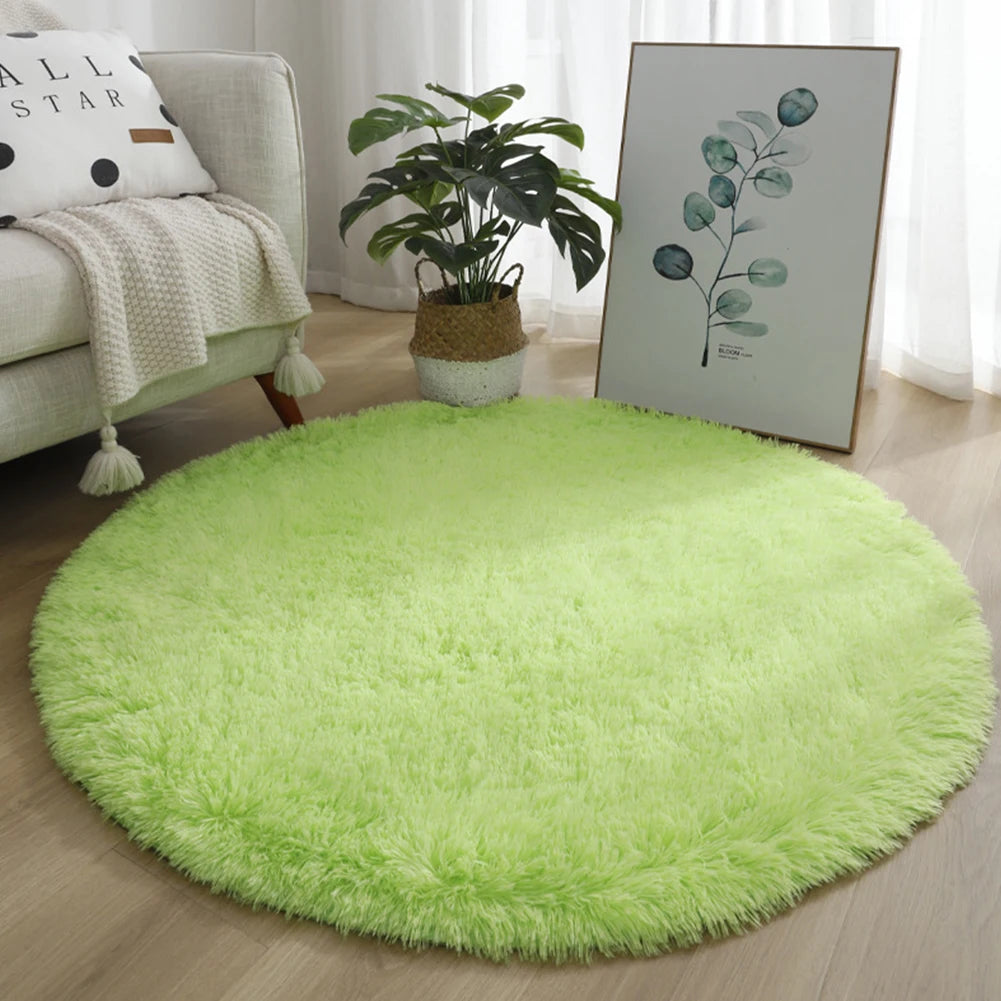 A bright lime green shaggy round area rug placed on a wooden floor next to a sofa and a potted plant.