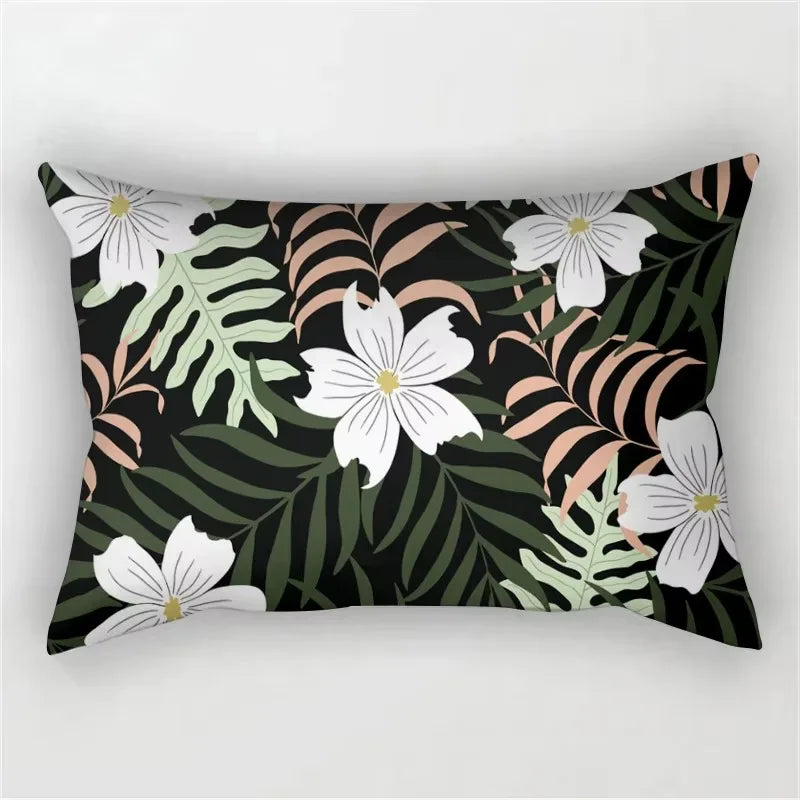 A dark green tropical leaf print pillowcase featuring white flowers and brown accents.