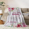 A soft pink and green floral flannel throw blanket with 'Best Mom Ever' and 'I Love You' text