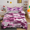 A purple and pink camouflage duvet cover set featuring a mottled pattern on a bed.
