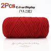 A spool of red elastic yarn used for crafting, displayed against a white background.