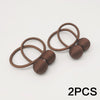 Two brown leather magnetic ball curtain tiebacks with coiled cords