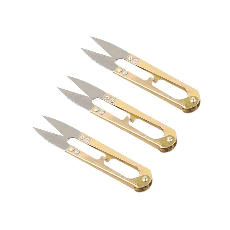 A pair of gold-toned U-shape sewing scissors used for cutting thread, yarn, fabric, and needlework.