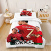 A red soccer print comforter set featuring three players in a football kit on a white background.