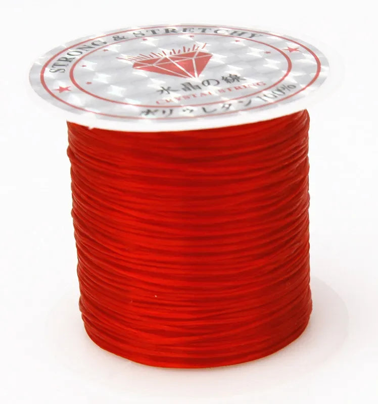 A spool of red strong and stretchy crystal string for beading