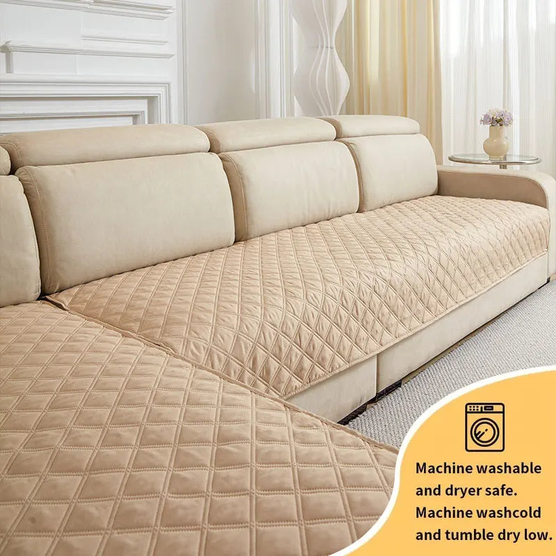 Tan quilted sofa cushion cover displayed on a beige sofa, showing its texture and washing instructions.