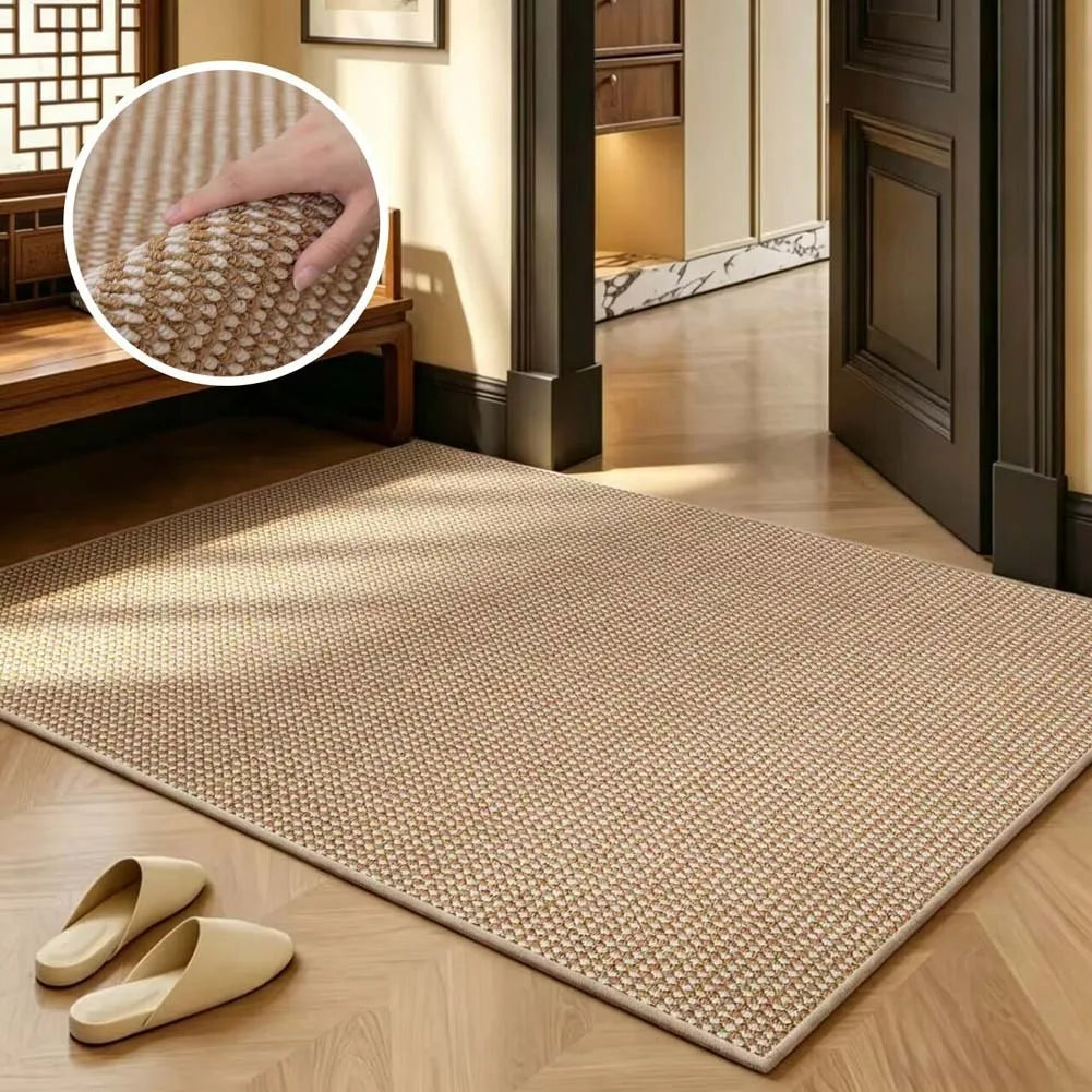 A rectangular beige faux sisal runner rug placed on a light wood floor.