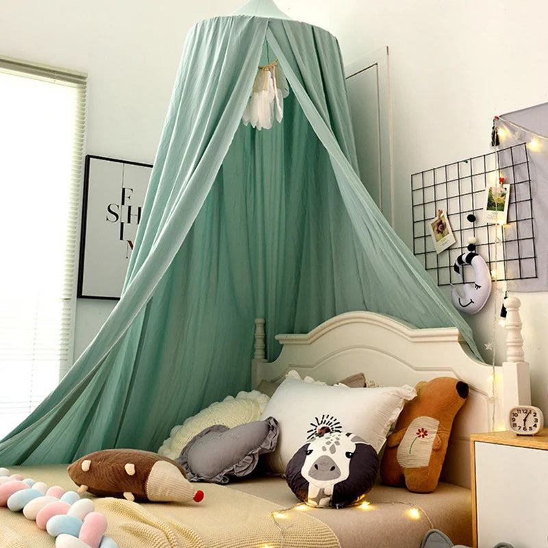 A princess hanging bed canopy with light green fabric and stuffed animals in a bedroom setting.
