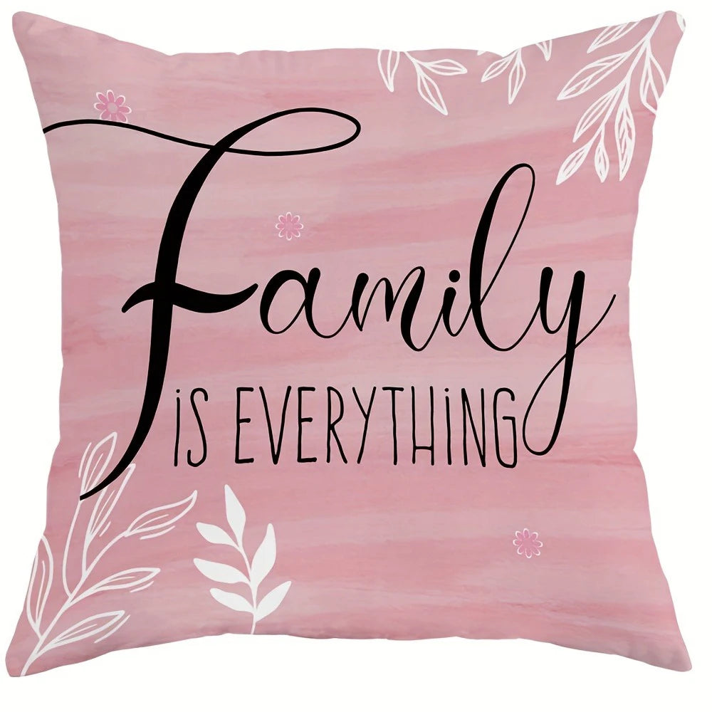 Pink decorative pillow cover with black script text reading Family is everything