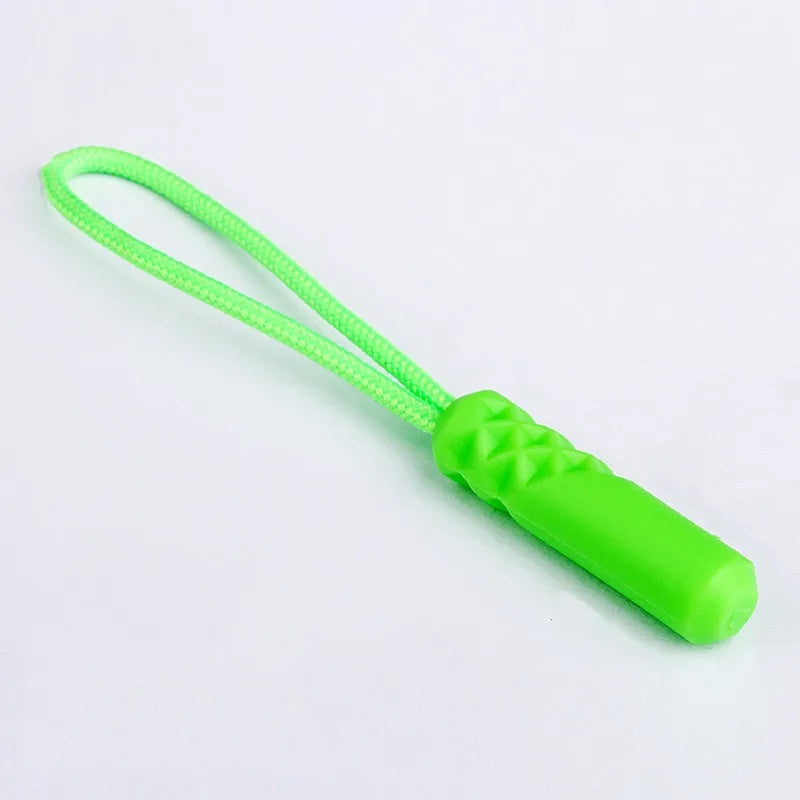A bright lime green zipper pull replacement clip on a green elastic cord.