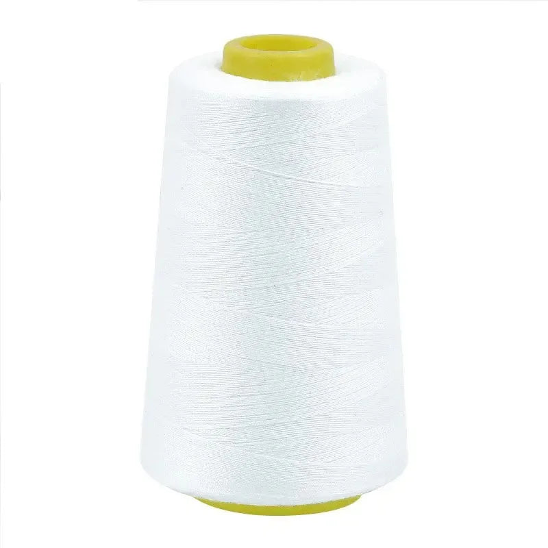 A white spool of premium sewing thread with a yellow core.