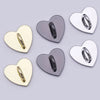 A collection of shiny metal heart-shaped phone charm connectors in gold and silver tones.