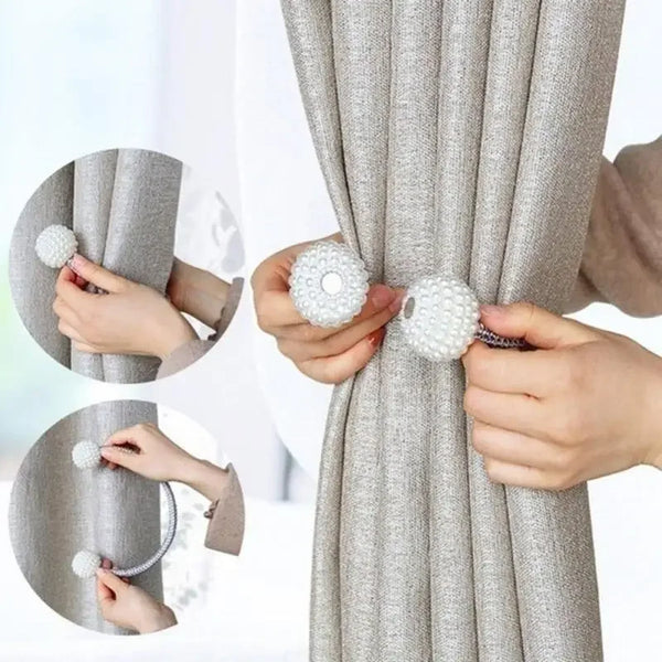 Hands are shown using pearl magnetic curtain tie back clips to secure a gray fabric curtain.