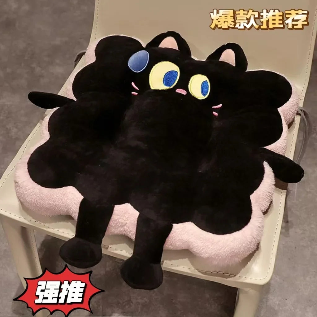 A black cartoon toast seat cushion with yellow eyes is shown resting on a light-colored chair.