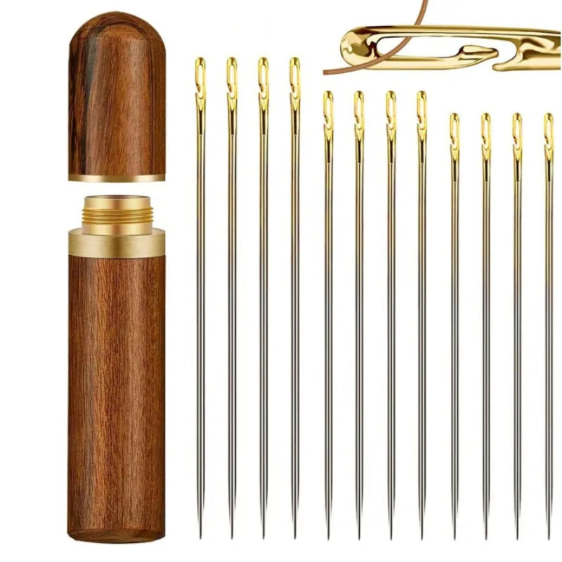 A set of stainless steel self-threading sewing needles housed in a wooden container.