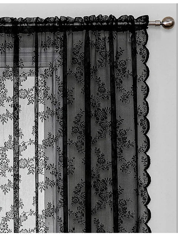 Black vintage floral lace curtains hanging on a rod