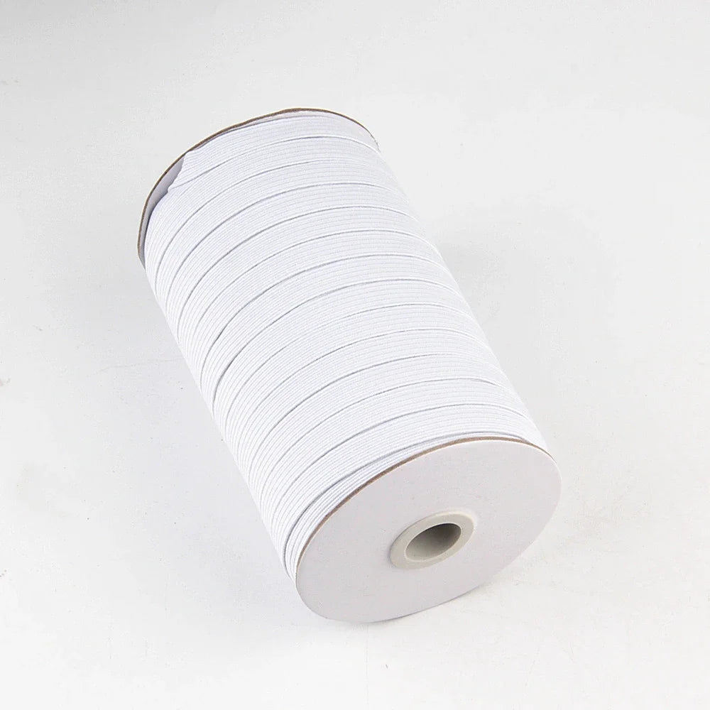 A roll of white adjustable elastic bands for garments.