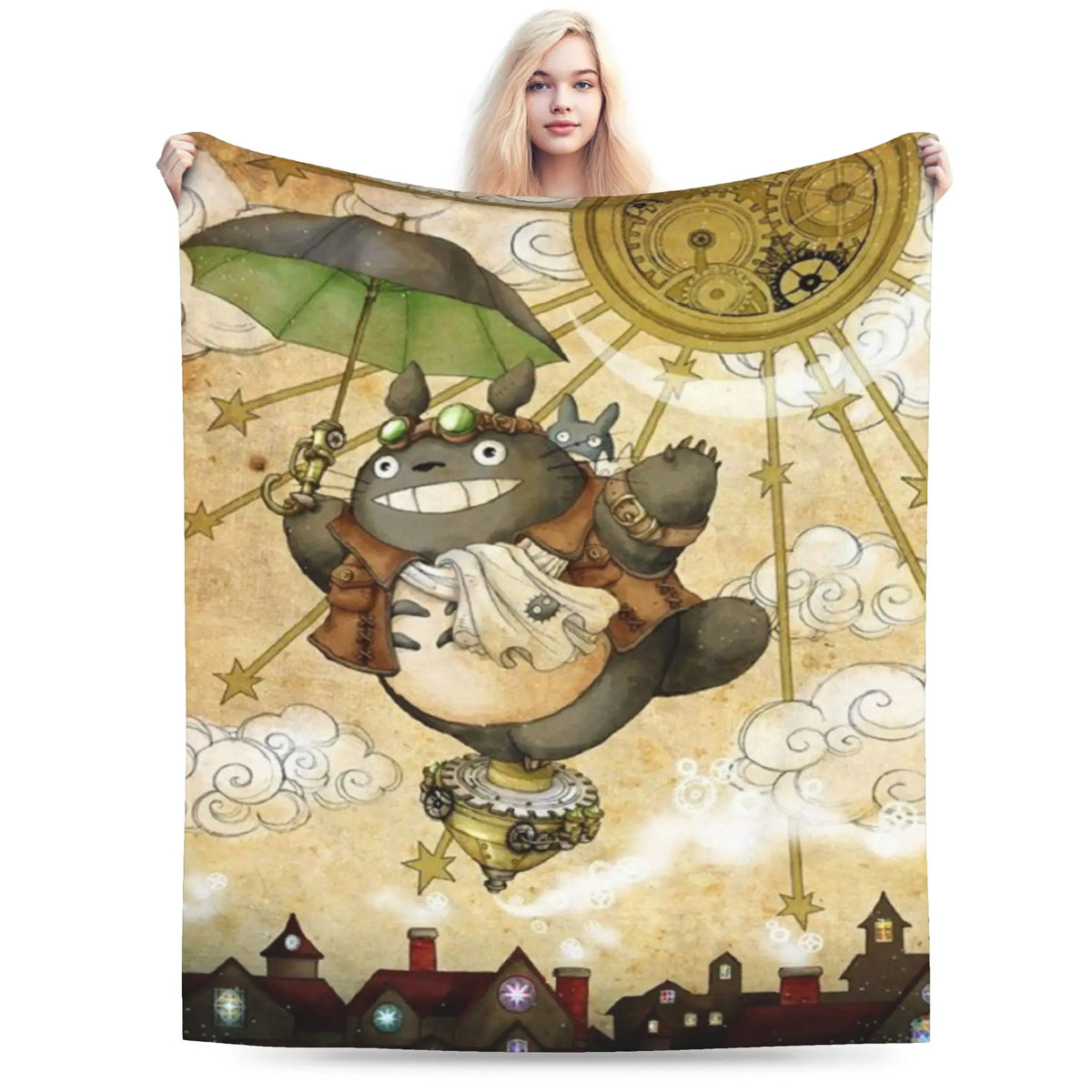 A fleece throw blanket featuring a Totoro character design with large eyes and a green umbrella against a light background.