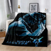 A dark blue and black retro printed flannel throw blanket featuring a stylized figure.
