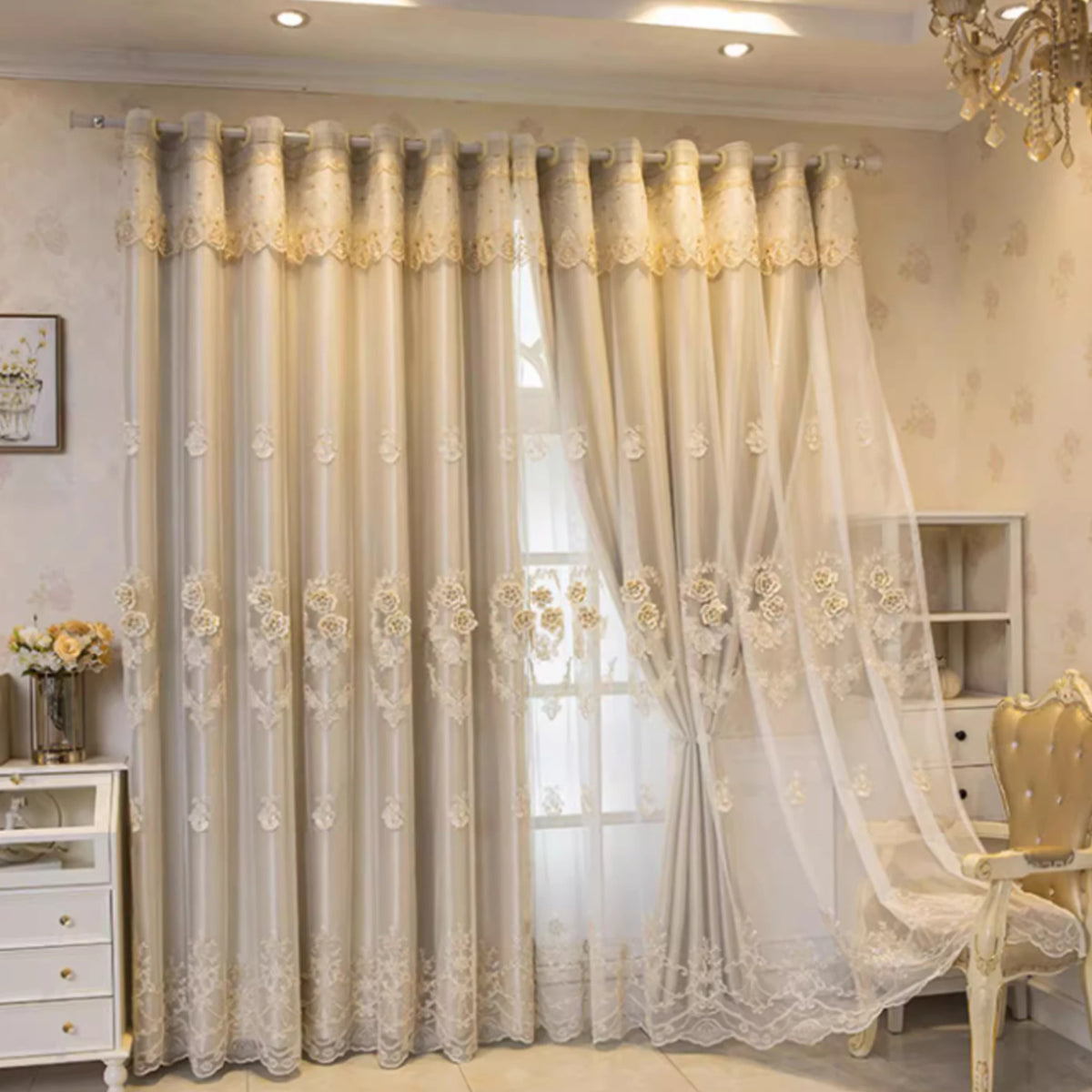 Cream and white dual-layer blackout curtains with eyelet tops hanging in a window.