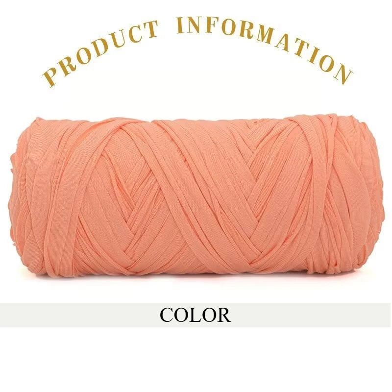 A skein of thick, coral-colored polyester blended yarn for crafting.