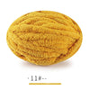 A ball of extra thick hand-knitted yarn in a golden yellow color.