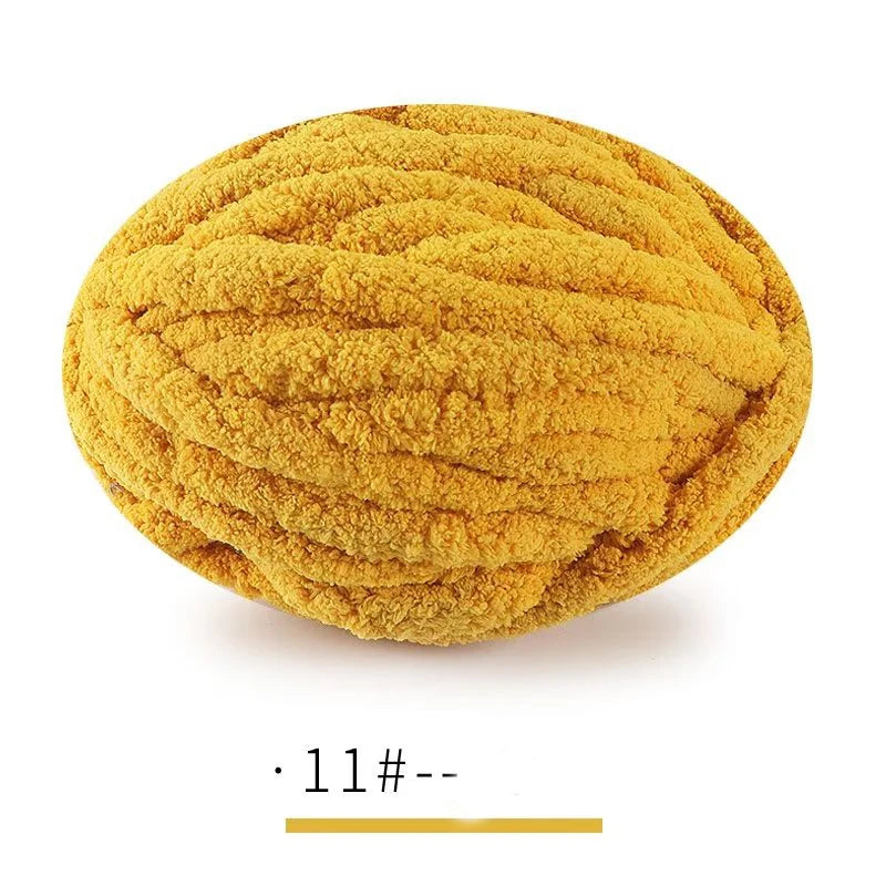 A ball of extra thick hand-knitted yarn in a golden yellow color.