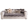 A plush sofa cover in gray stripes featuring a large, light-colored flower accent.