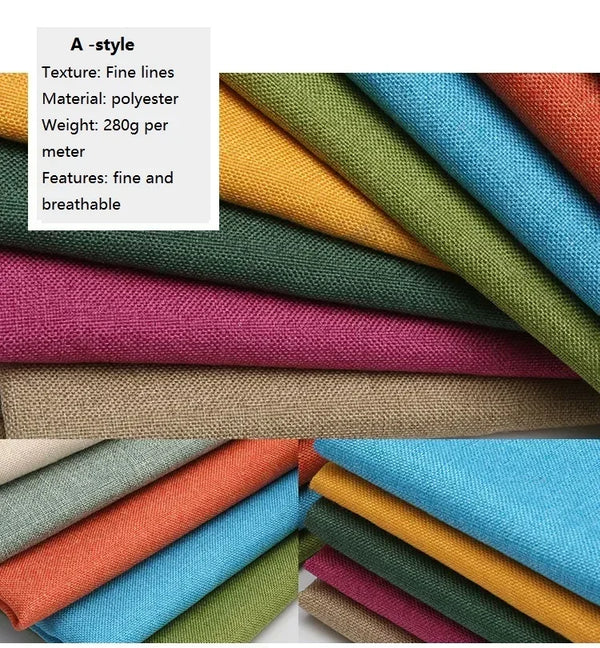 A stack of various colored coarse linen and cotton fabric rolls in shades of green, yellow, pink, blue, and orange.