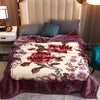 A plush purple mink fleece blanket featuring a floral pattern of roses and peonies.