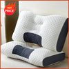 A white ergonomic contour neck pillow with dark gray accents is shown on a light surface.